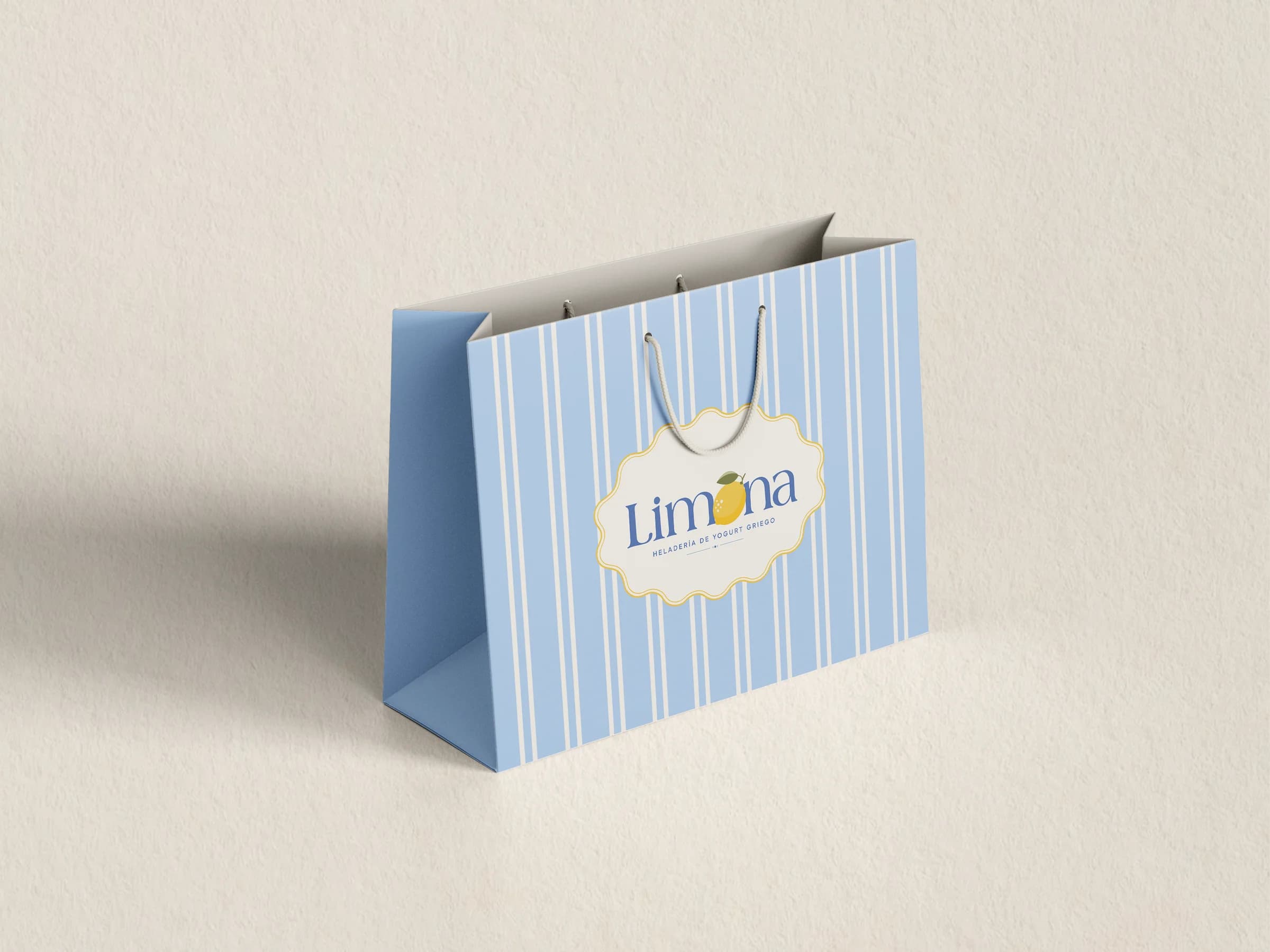 Blue striped Limona bag with the logo in a scalloped label